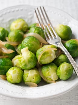 Cooked brussel sprouts with onion close up shoot