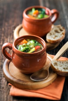 Vegeterian soup on wooden background close up