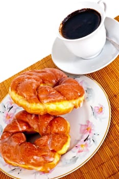 Delicious donuts with coffee for breakfast