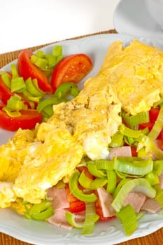 Omelet with vegetables and coffee for breakfast