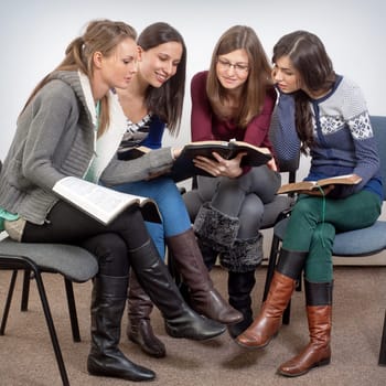 Young woman teacher teach God's Words to a women team