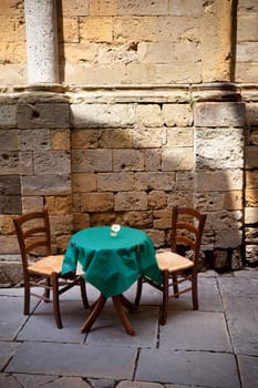 table for two near ancient wall