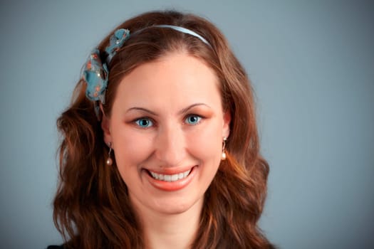 Studio portrait of a beautiful 20 year old redhead woman.