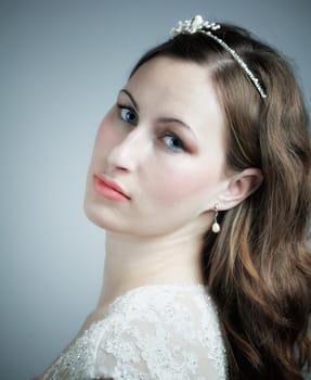 Studio portrait of a beautiful young bride, head shot.