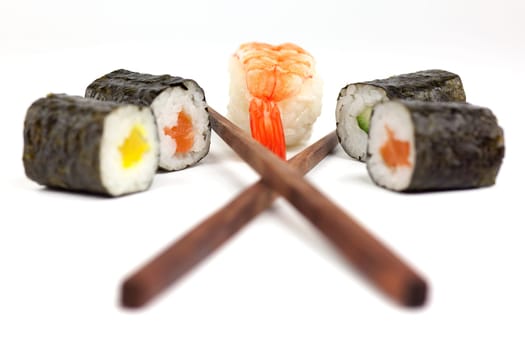 Sushi with chopsticks,Japanese food against white background
