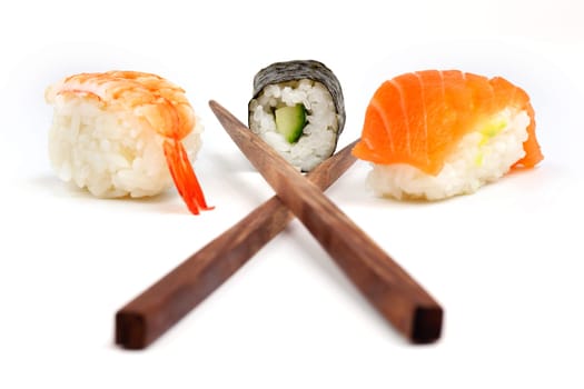 Sushi with chopsticks,Japanese food against white background