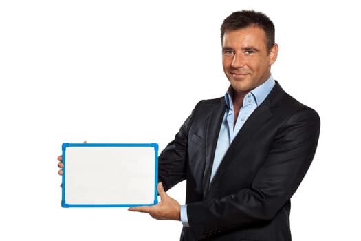 one caucasian business man holding showing whiteboard in studio isolated on white background