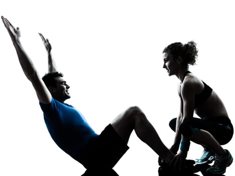 one caucasian couple man woman personal trainer coach exercising abdominal silhouette studio isolated on white background