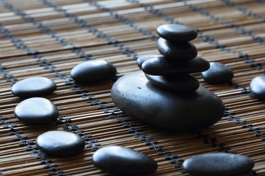 details of a tranquil scene, made with a stack of black pebbles.