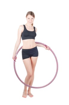 Fitness woman with hula hoop, isolated on white