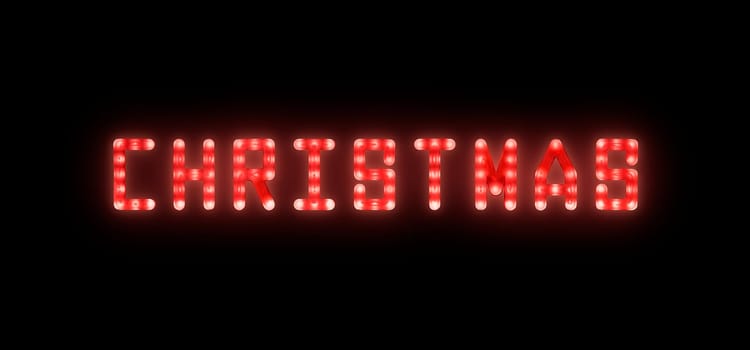 Close up red neon glowing bright led light CHRISTMAS sign on black background