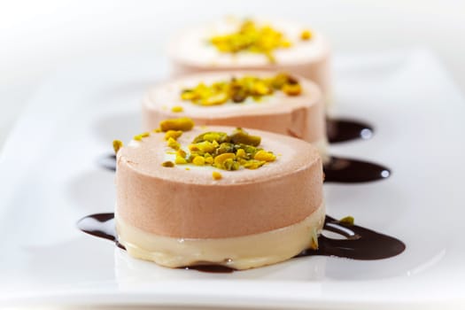 Delicious small cream cakes with pistachio