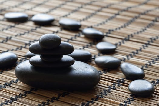 details of a tranquil scene, made withe stack of black pebbles.