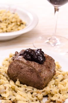 Roast venison with spaetzle with mushrooms and dark sauce