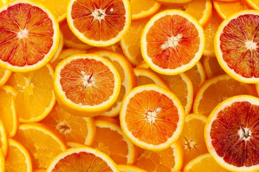 Oranges,fresh citrus fruit in slices as background