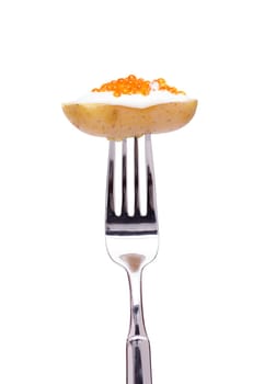 Potato with salmon caviar on a fork