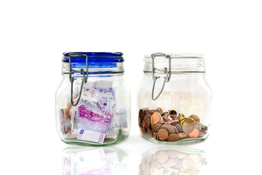 Euro notes and coins in mason jars