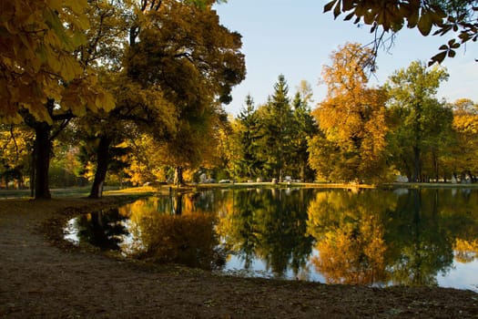 Beautiful colors of autumn landscape by the lake