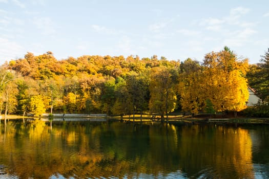 Beautiful colors of autumn landscape by the lake