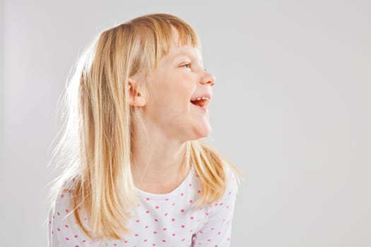 Studio portrait of happy smiling young girl
