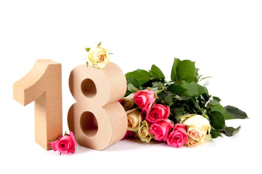 Number of age in a colorful studiosetting,surrounded with roses