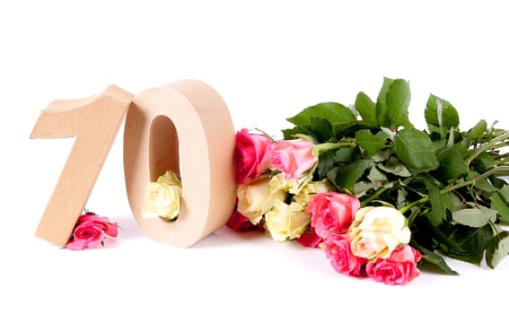 Number of age in a colorful studiosetting,surrounded with roses