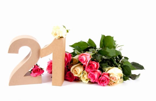 Number of age in a colorful studiosetting,surrounded with roses
