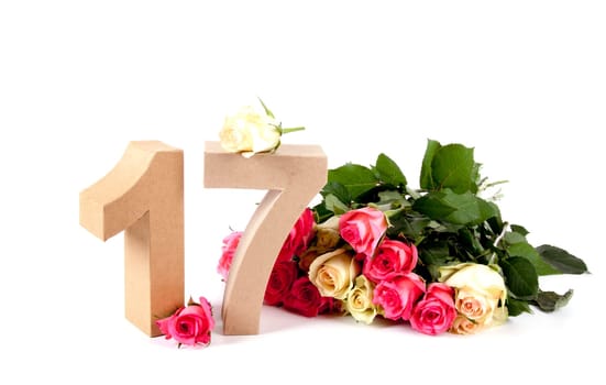 Number of age in a colorful studiosetting,surrounded with roses