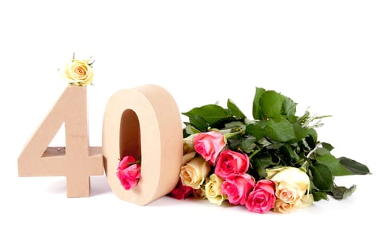 Number of age in a colorful studiosetting,surrounded with roses