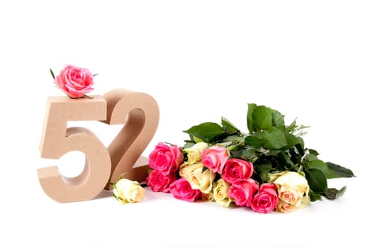Number of age in a colorful studiosetting,surrounded with roses