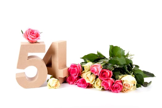 Number of age in a colorful studiosetting,surrounded with roses