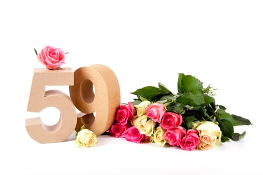 Number of age in a colorful studiosetting,surrounded with roses