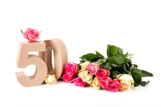 Number of age in a colorful studiosetting,surrounded with roses