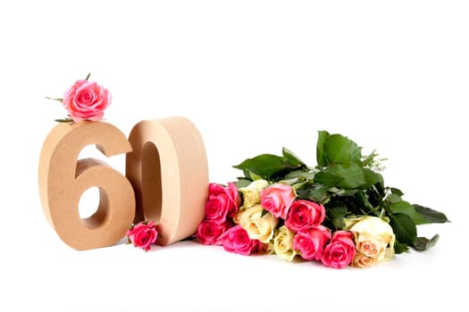 Number of age in a colorful studiosetting,surrounded with roses