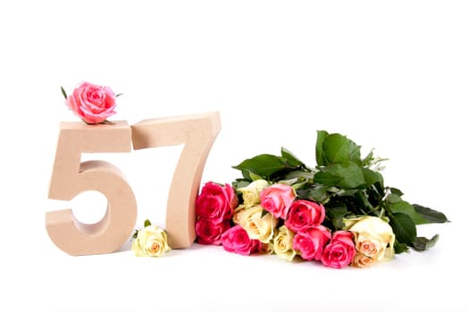 Number of age in a colorful studiosetting,surrounded with roses