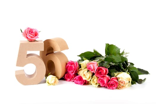 Number of age in a colorful studiosetting,surrounded with roses