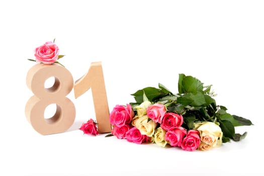 Number of age in a colorful studiosetting,surrounded with roses