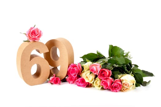 Number of age in a colorful studiosetting,surrounded with roses