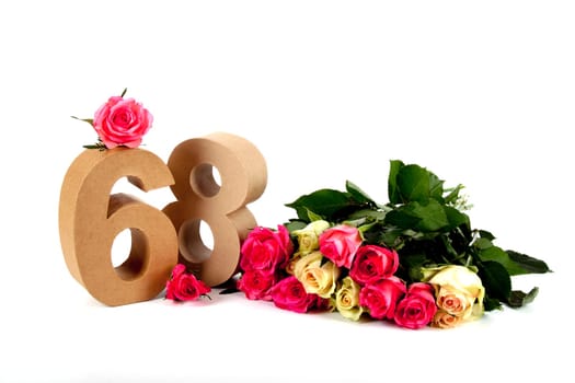 Number of age in a colorful studiosetting,surrounded with roses