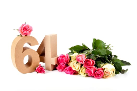 Number of age in a colorful studiosetting,surrounded with roses