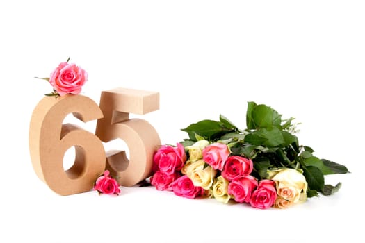 Number of age in a colorful studiosetting,surrounded with roses