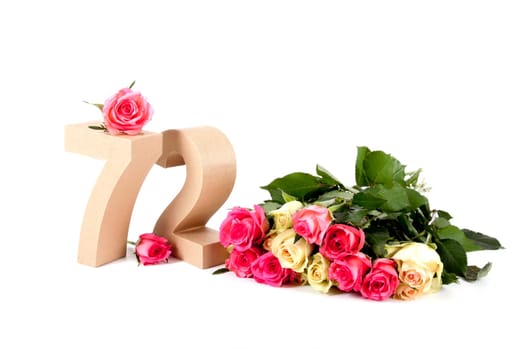 Number of age in a colorful studiosetting,surrounded with roses
