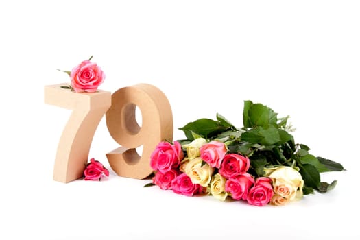 Number of age in a colorful studiosetting,surrounded with roses