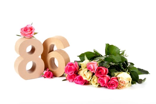 Number of age in a colorful studiosetting,surrounded with roses