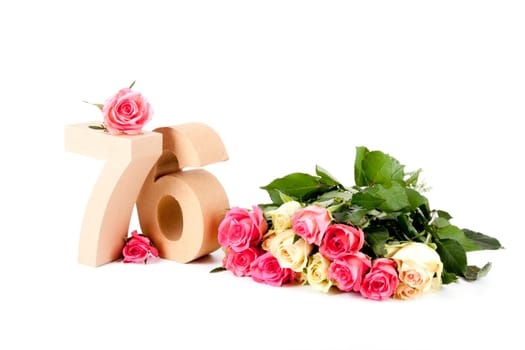 Number of age in a colorful studiosetting,surrounded with roses