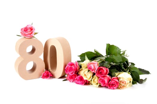 Number of age in a colorful studiosetting,surrounded with roses