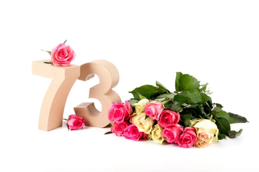 Number of age in a colorful studiosetting,surrounded with roses