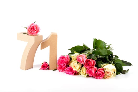 Number of age in a colorful studiosetting,surrounded with roses