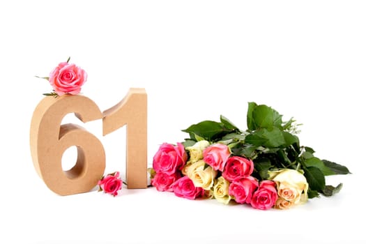 Number of age in a colorful studiosetting,surrounded with roses