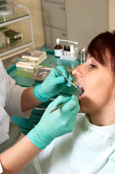 Dental treatment in a young woman in a dentist's office
